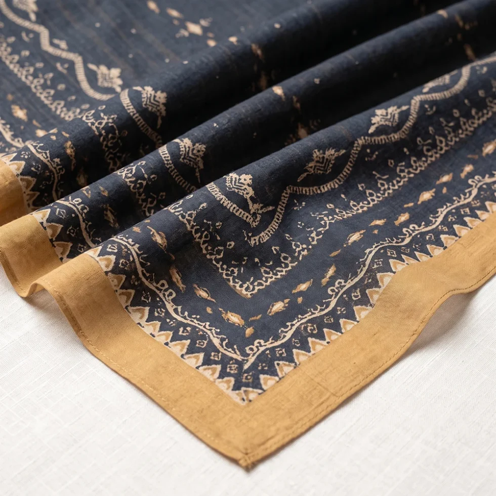 Black geometric printed ladies dupatta with decorative traditional patterns and golden border